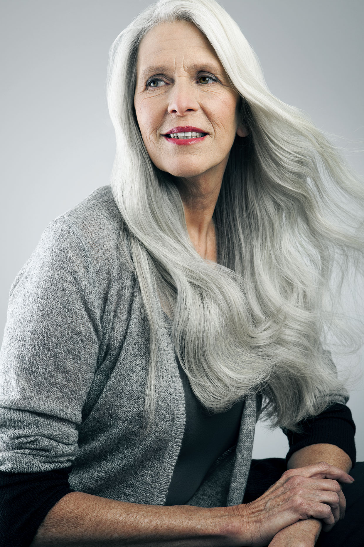 Mature Woman With Long Gray Hair Looking Away Andreas Kuehn